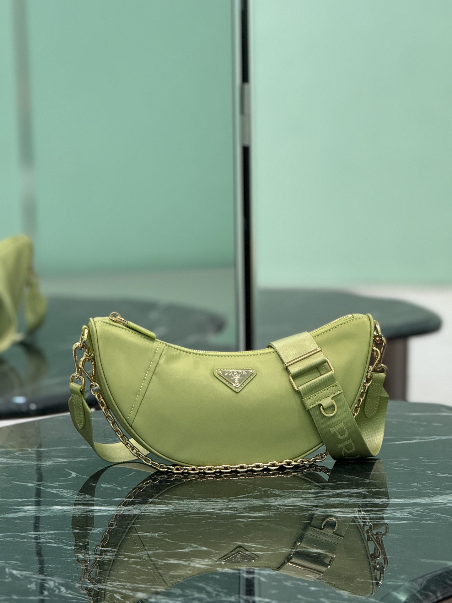 Prada 프라다 Re-Nylon 하프문 체인 숄더백 1