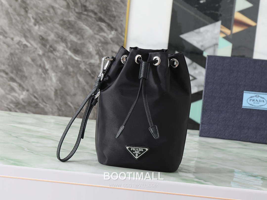 Prada Re-Nylon Drawstring Pouch Recycled Nylon, Calfskin Leather Black 프라다 리나일론 드로스트링 파우치 1NS369_R067_F0002 리사이클 나일론, 카프스킨 가죽 블랙 23cm 1
