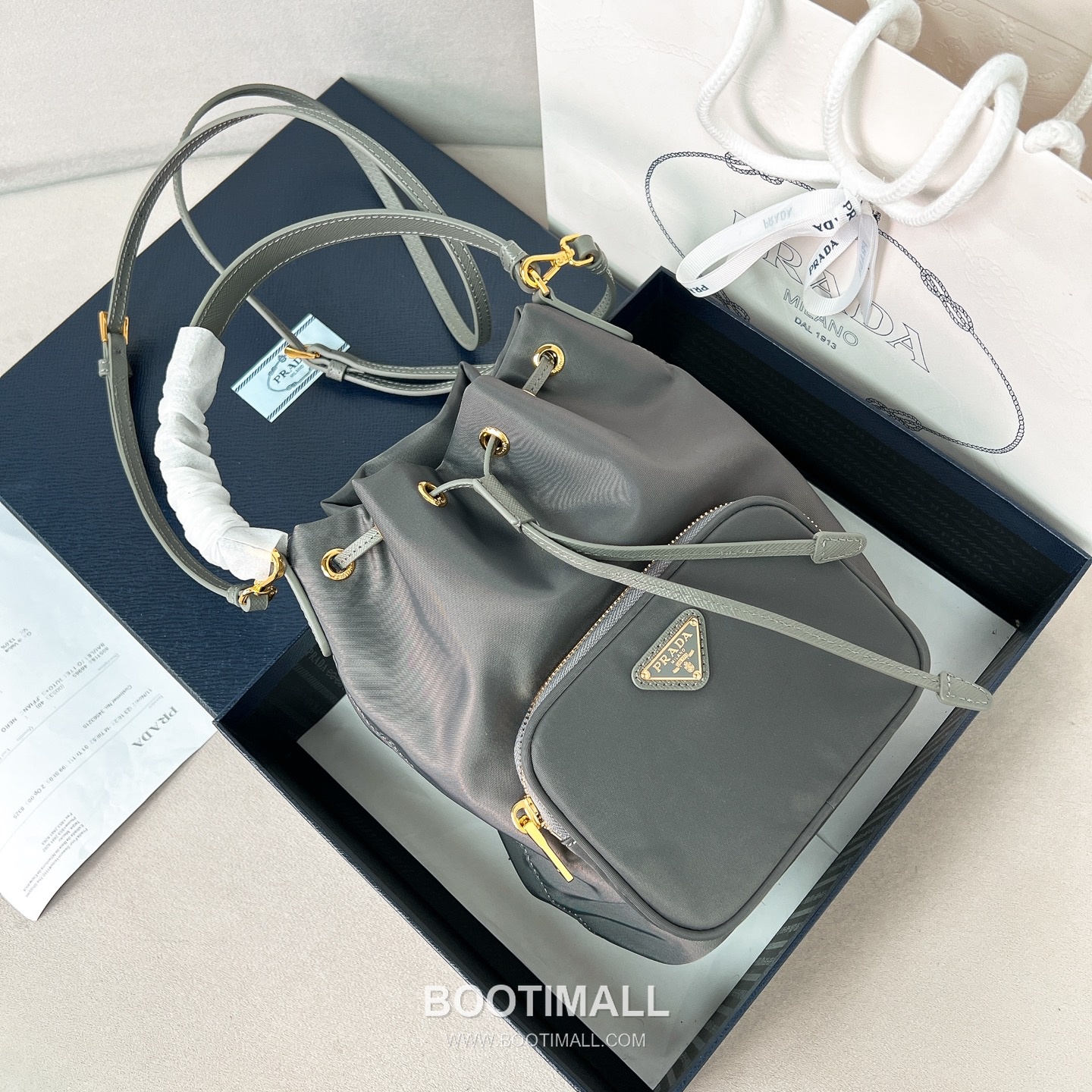 Prada Parachute Nylon Bucket Bag with Triangle Logo Drawstring Detail 프라다 패러슈트 나일론 트라이앵글 로고 드로우스트링 버킷백 1BH038 18cm 1
