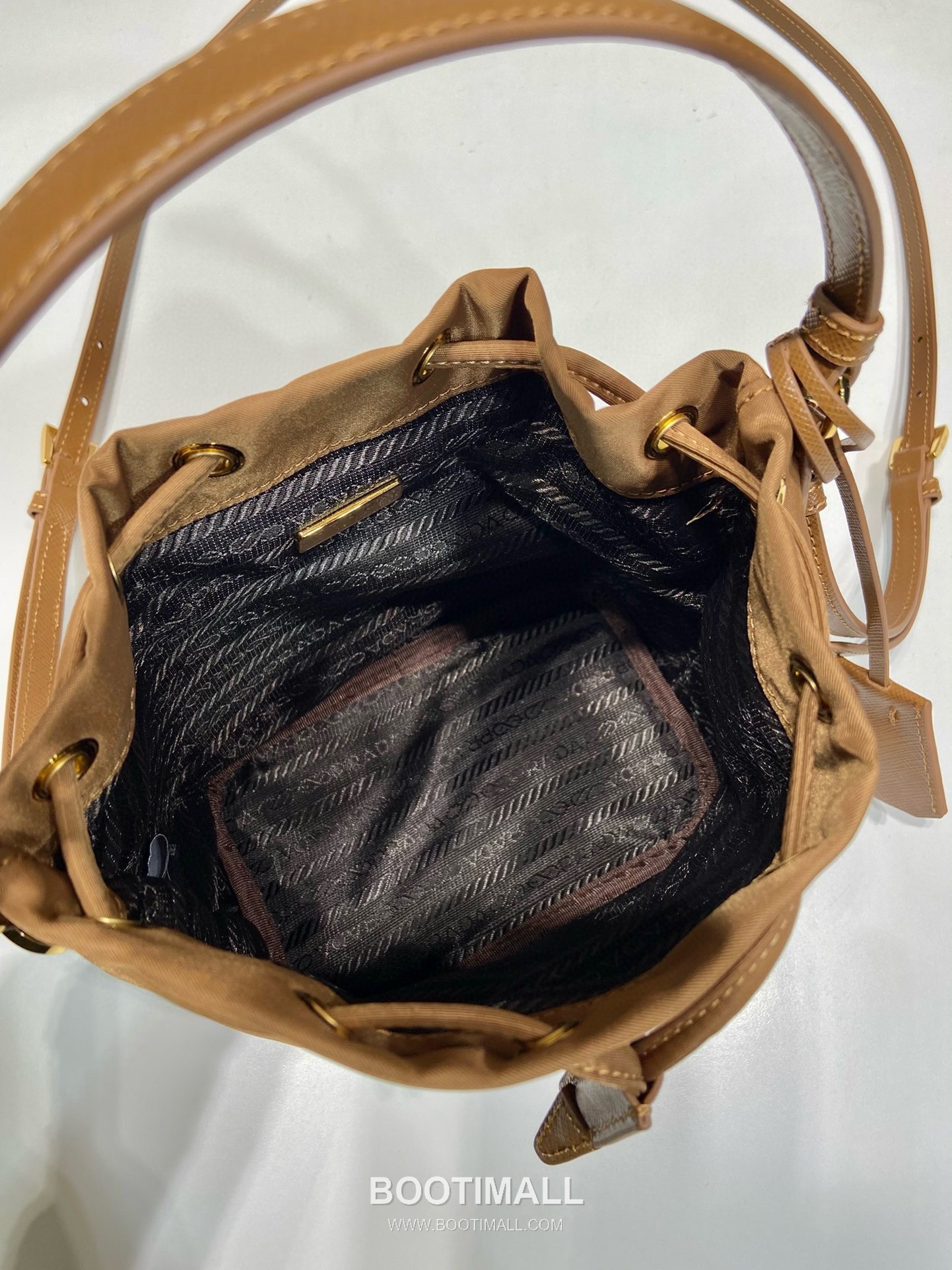 Prada Nylon Bucket Bag with Calfskin Strap Triangle Logo Key Charm Detail 프라다 나일론 카프스킨 스트랩 트라이앵글 로고 키참 버킷백 1BE067 15.5cm 16