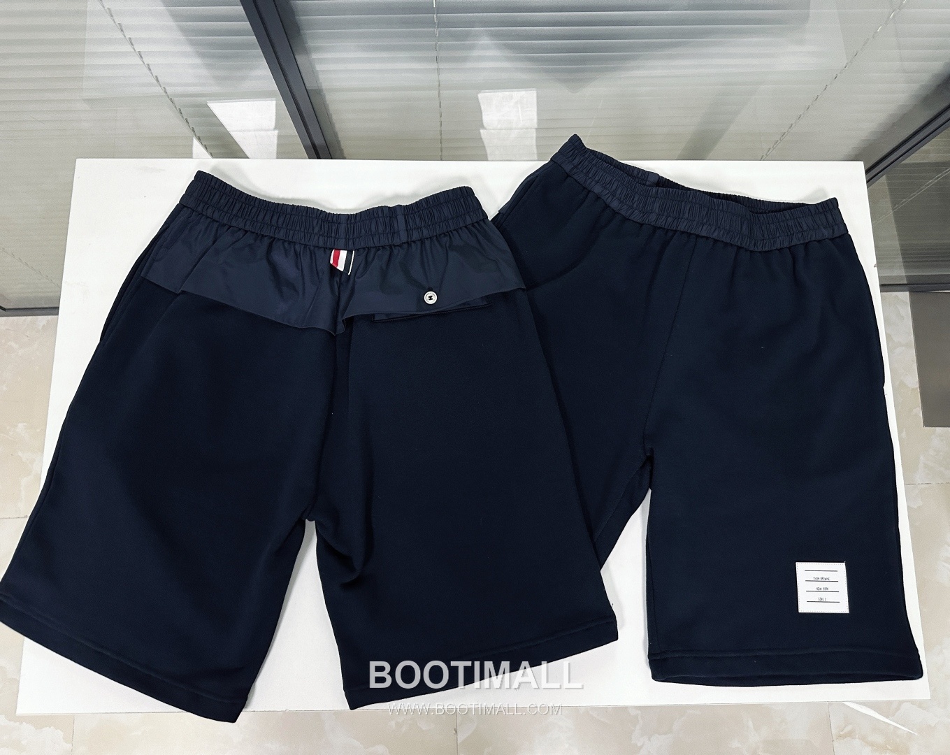 Thom Browne SS26 Cotton Patchwork Mid-Rise Sport Shorts with Logo Detail 톰브라운 SS26 코튼 패치워크 미드라이즈 스포츠 쇼츠 로고 디테일 9