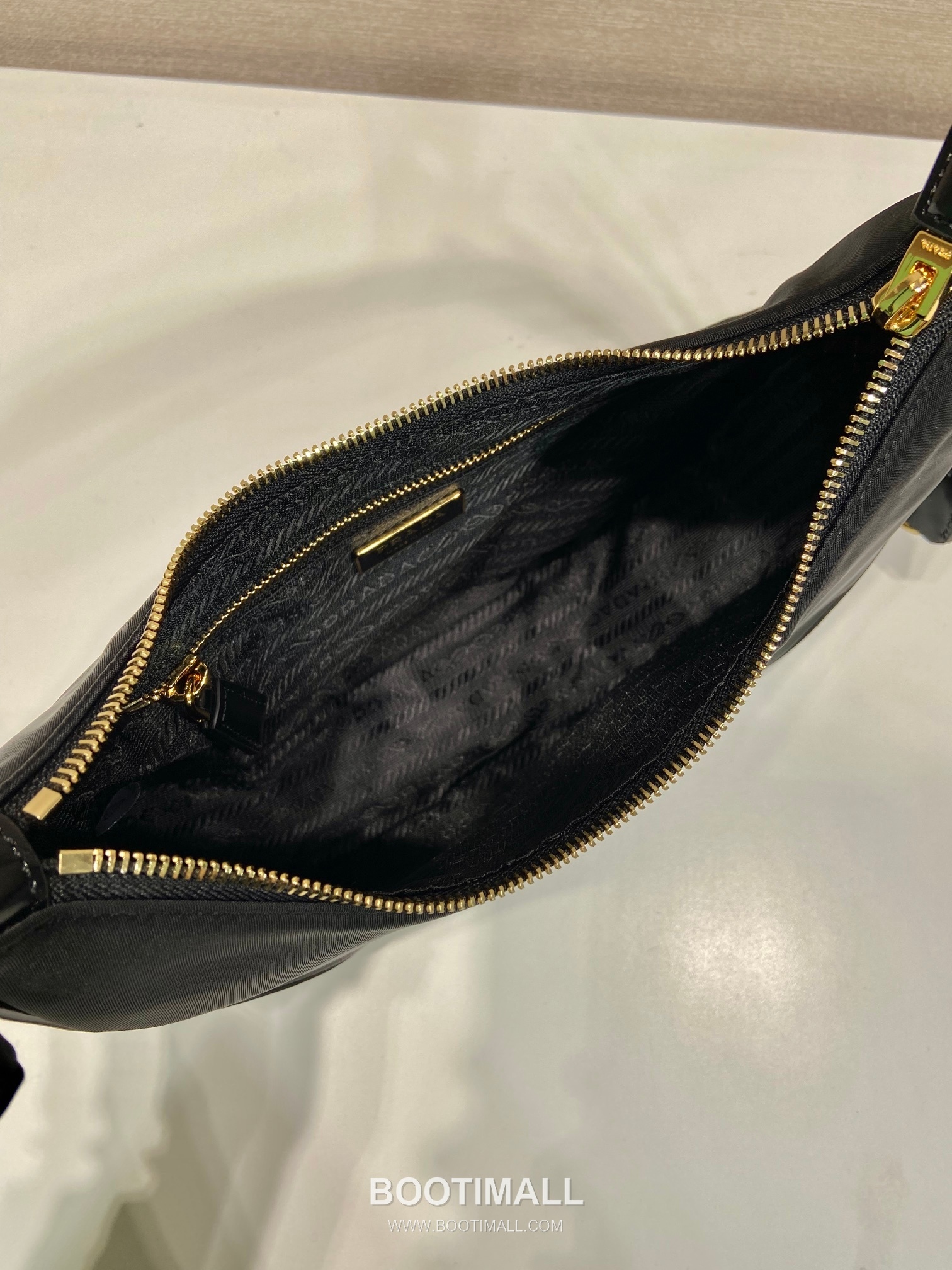 Prada Nylon Patent Leather Hobo Bag with Curved Shape and Metal Detail 프라다 나일론 페이턴트 가죽 커브드 메탈 디테일 호보백 1BC214 27cm 8